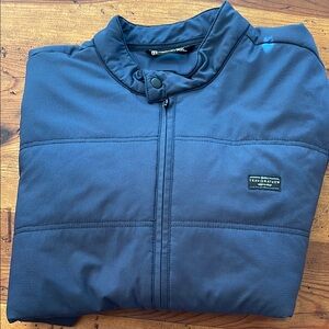 Travis Mathew Navy puffy jacket full zipper and front pockets